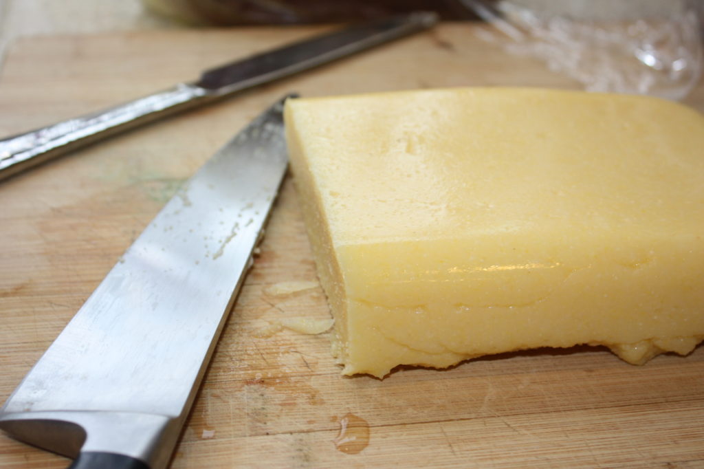 slicing cornmeal mush