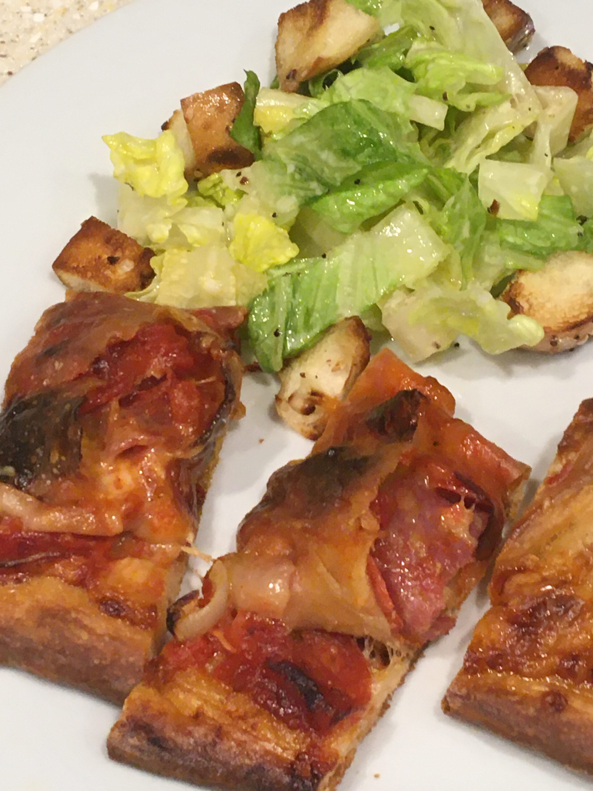 everything bagel croutons with salad and stromboli